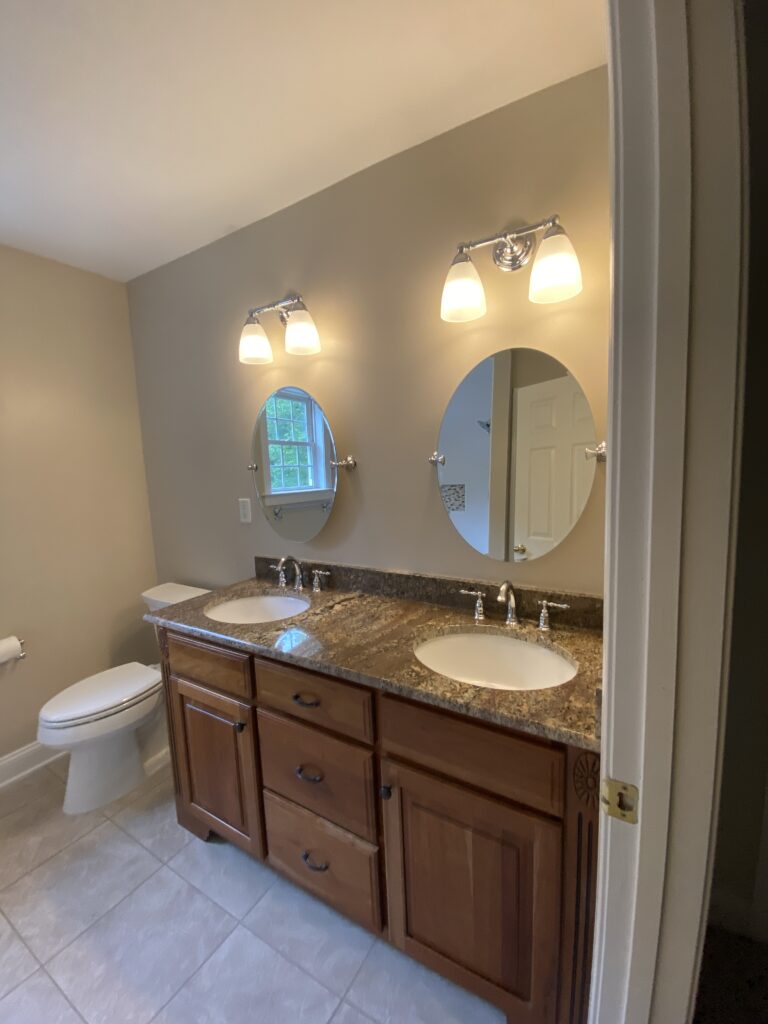 Bathroom with double sink and mirrors.