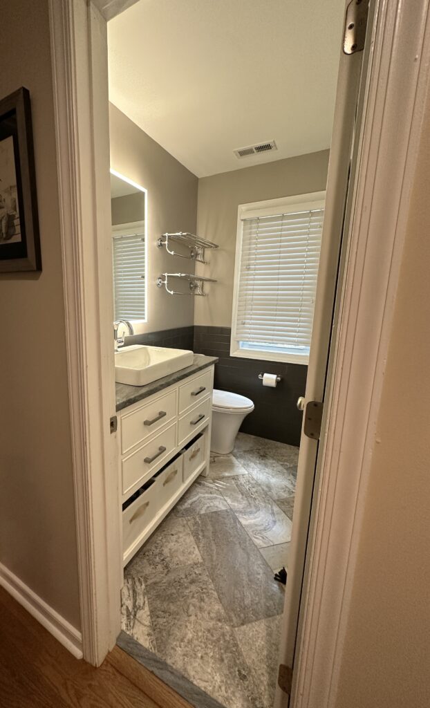 Small bathroom with sink and toilet.