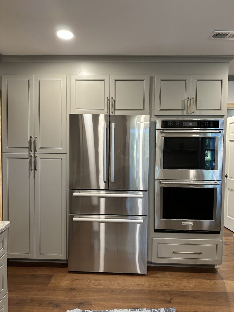 Modern kitchen with stainless steel appliances.