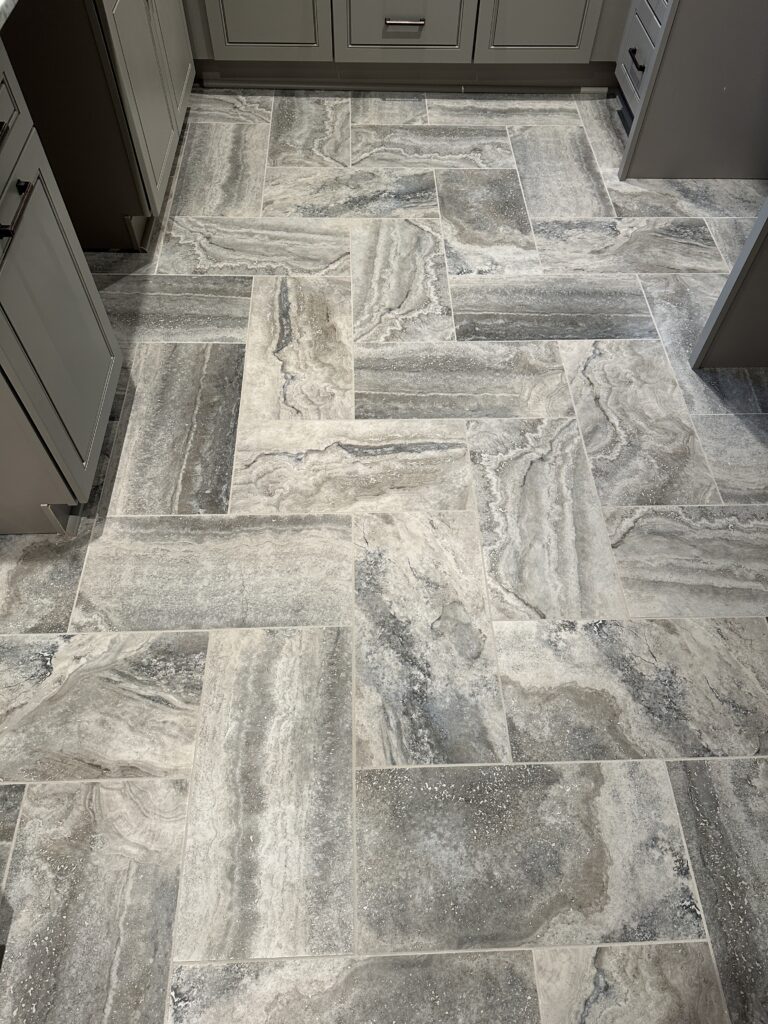 Gray marble tile floor in a kitchen.