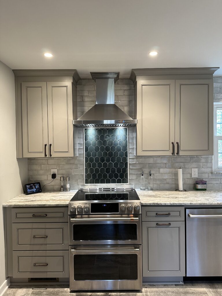Modern kitchen with stainless steel appliances.