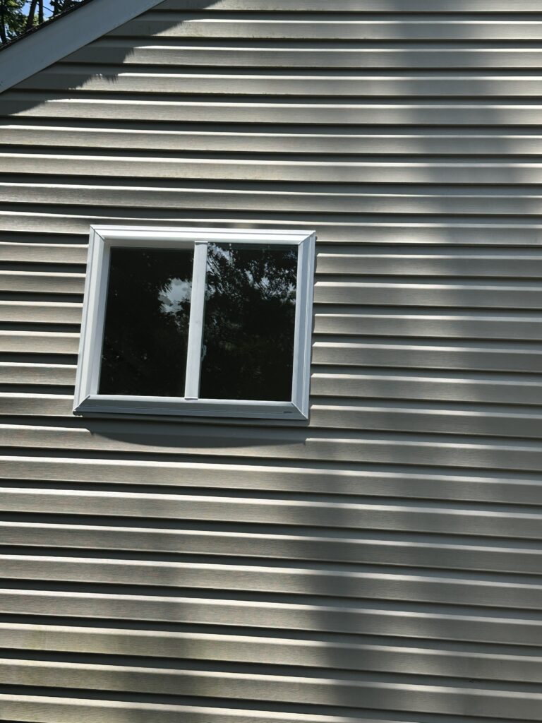 House siding with a small window.