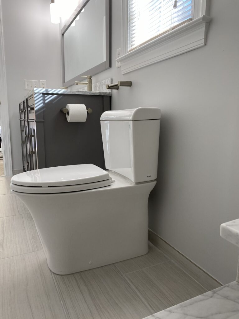 Modern bathroom with toilet and vanity.