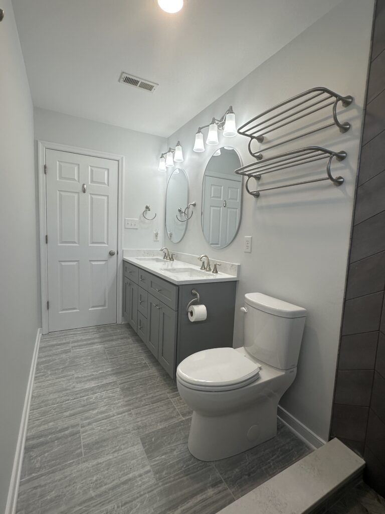 Modern bathroom with toilet and vanity.