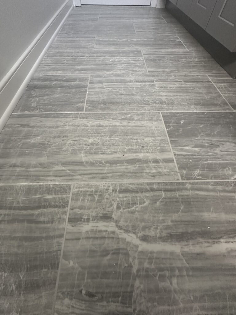 Gray marble tile hallway floor.