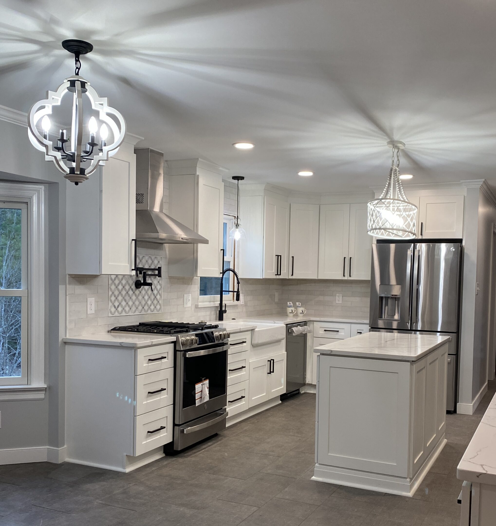 Bright white kitchen with marble island countertop