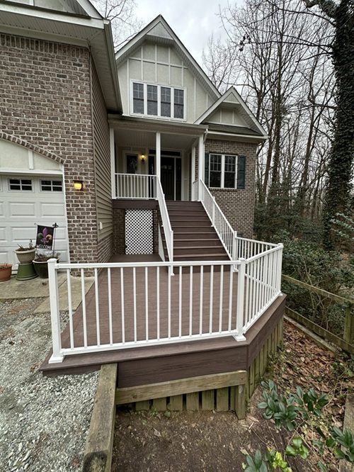 Front porch re-build featuring VekaDeck Espresso and White Aluminum Handrails